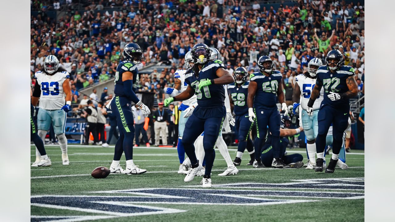 Seattle Seahawks running back DeeJay Dallas celebrates after scoring  against the Dallas Cowboys during the first half of a preseason NFL  football game Saturday, Aug. 19, 2023, in Seattle. (AP Photo/Lindsey Wasson