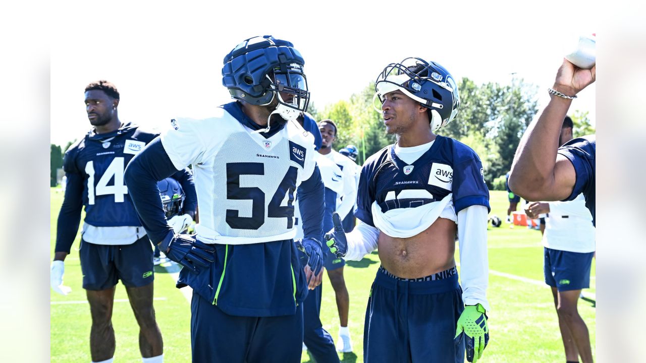 Seattle Seahawks wide receiver John Hall (82), linebacker Ben Burr-Kirven ( 48) and cornerback Montrae Braswell, right, celebrate during a preseason  NFL football game against the Dallas Cowboys, Saturday, Aug. 19, 2023, in