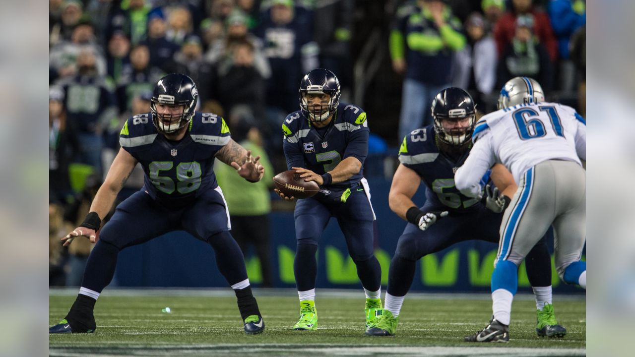 Seattle Seahawks head coach Pete Carroll and wide receiver Doug Baldwin  (89) watch a replay of a 42-yard catch he made in the fourth quarter of in  a Wild Card round game