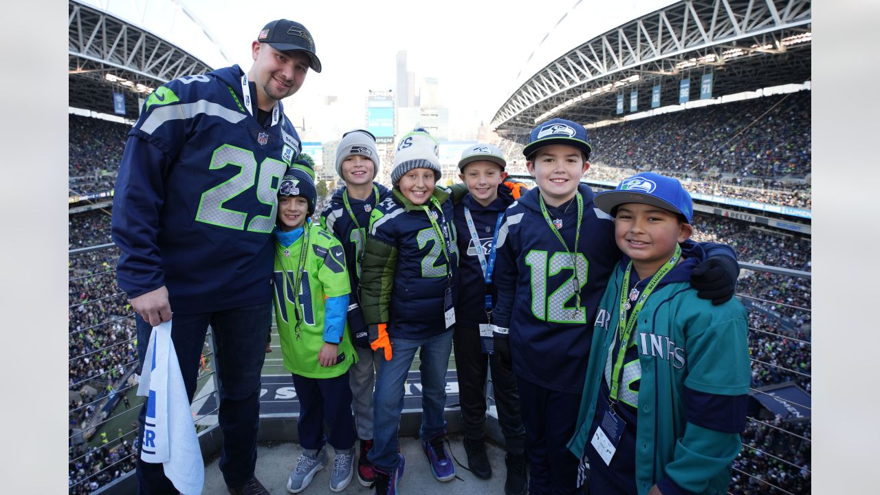 PHOTOS: Seattle Mariners Catcher Cal Raleigh Raises The 12 Flag