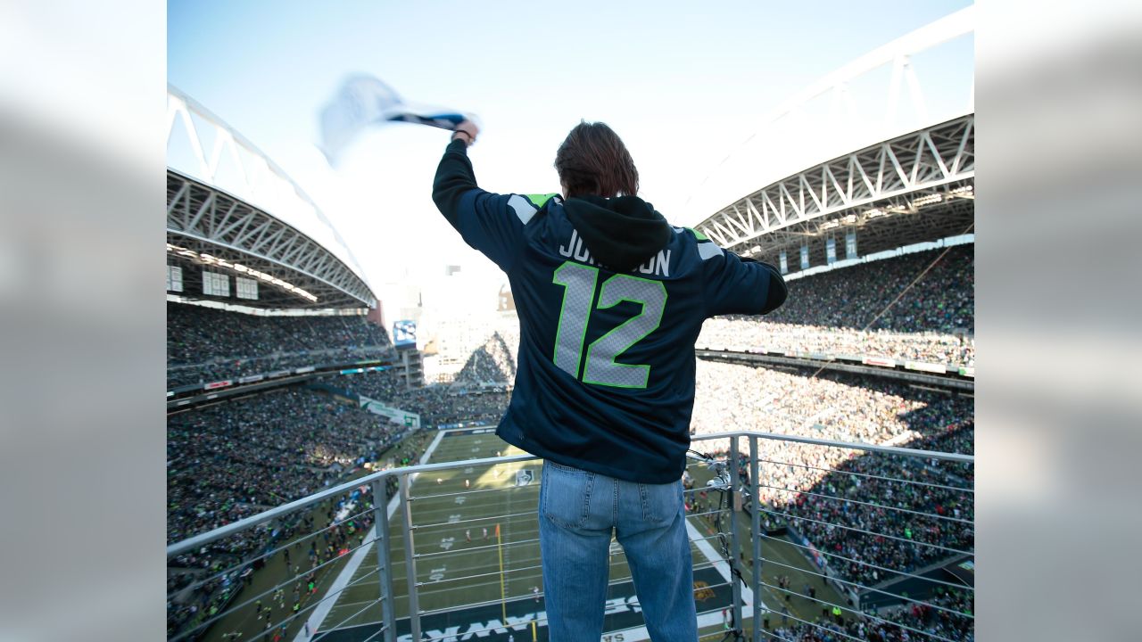 Randy Johnson worked as an NFL photographer after raising the Seahawks'  '12' flag