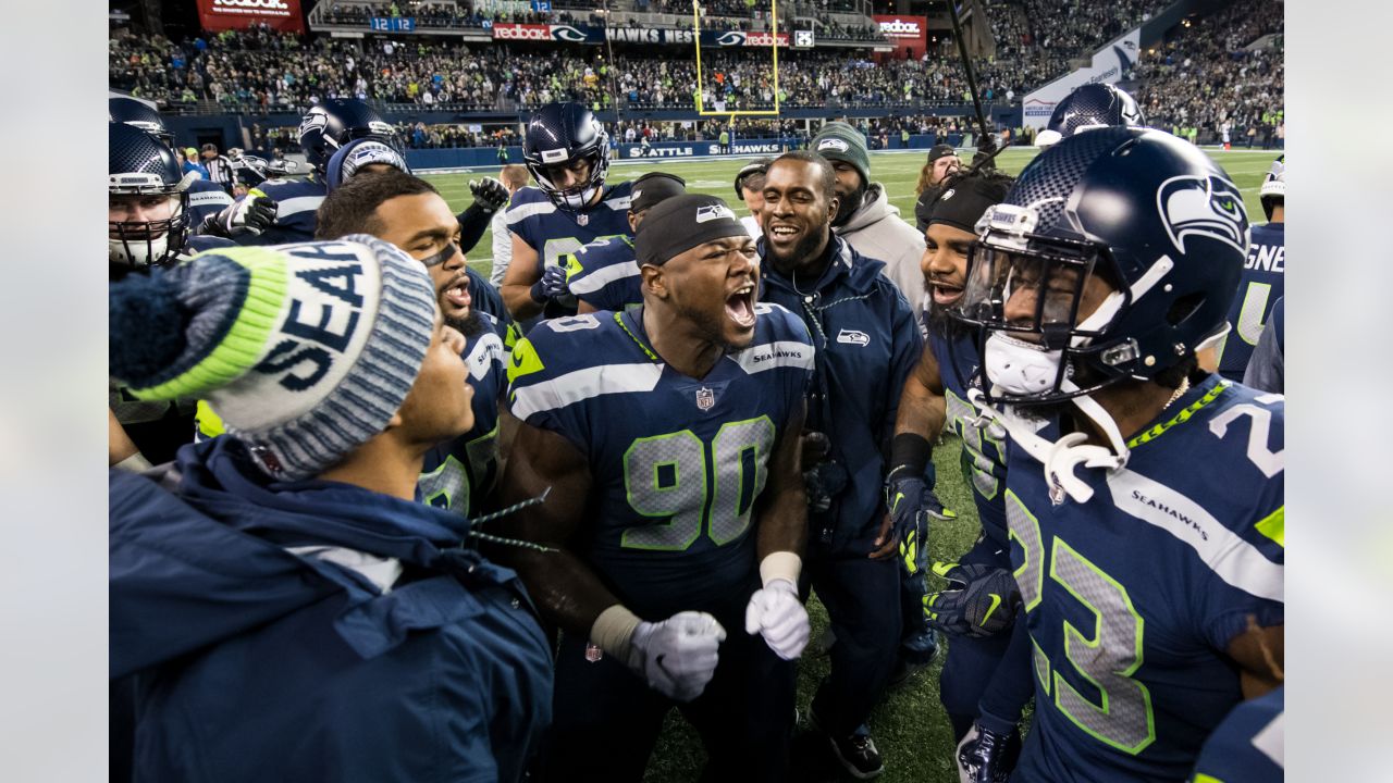 Seattle Seahawks' Jarran Reed (90) celebrates with Quinton