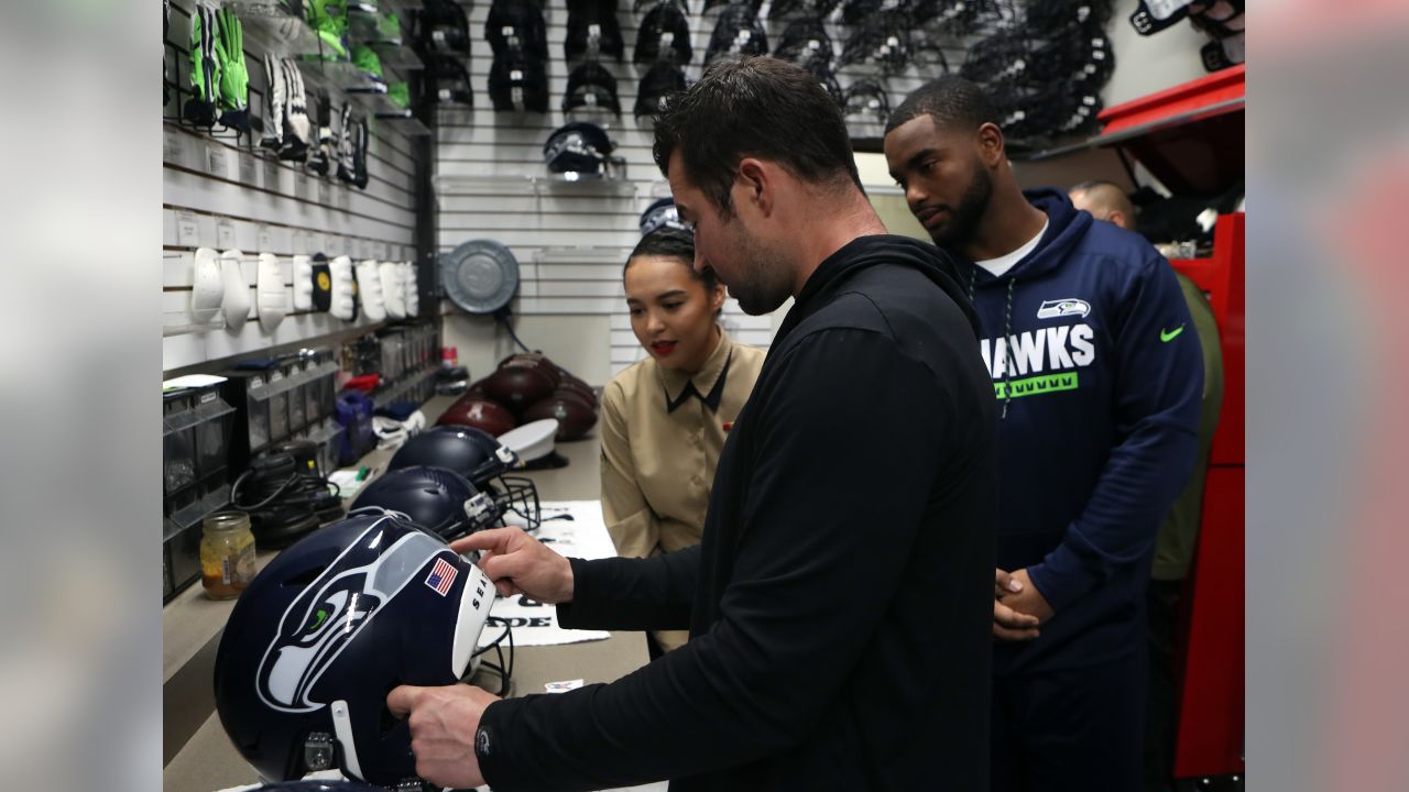 Seahawks, Military Members Place Decals On Helmets Ahead Of