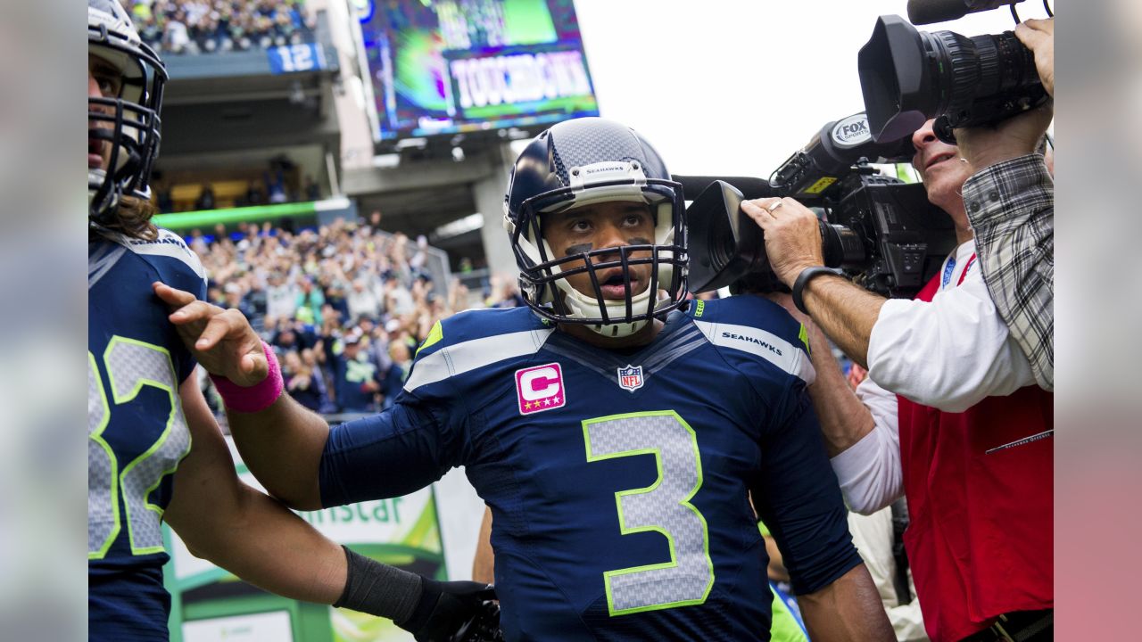 Chicago Bears wide receiver Bernard Berrian, left, catches a 40-yard pass  for a touchdown as Seattle Seahawks' Kelly Herndon, center, and Oliver  Celestin, right, defend during the third quarter of an NFL