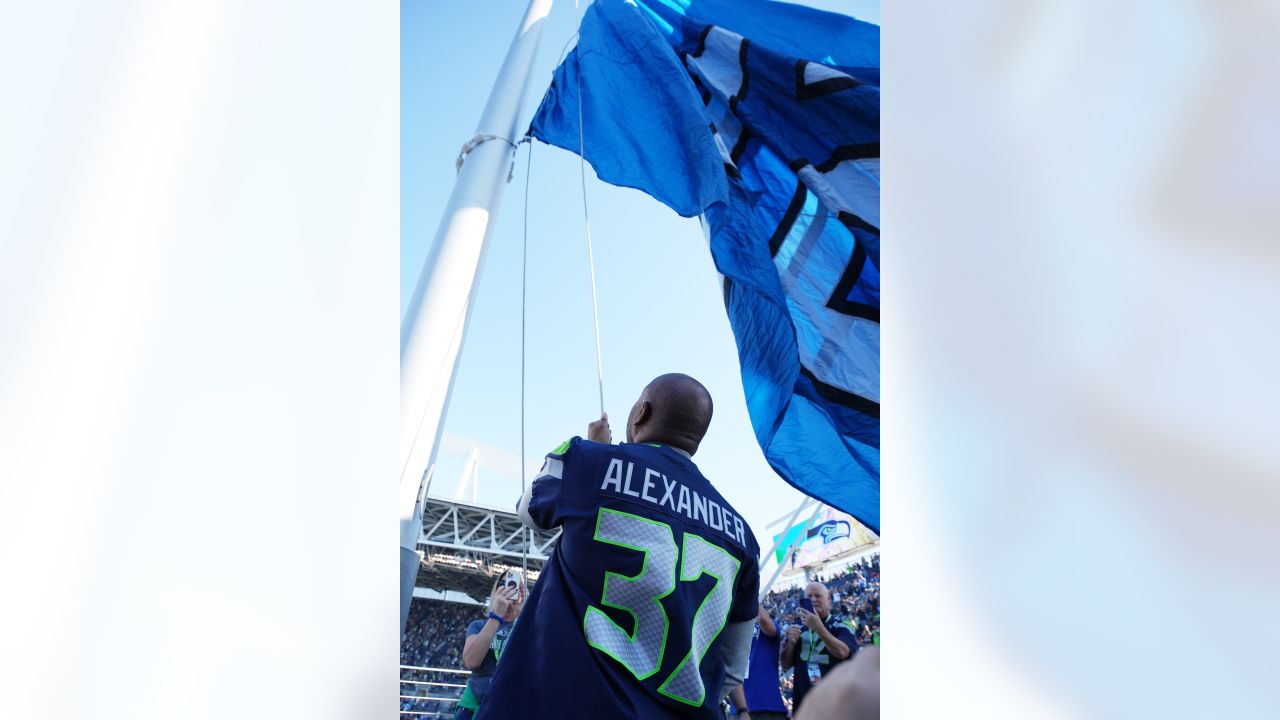 446th AW passes Seahawks' 12th-Man flag to Coast Guard > 446th