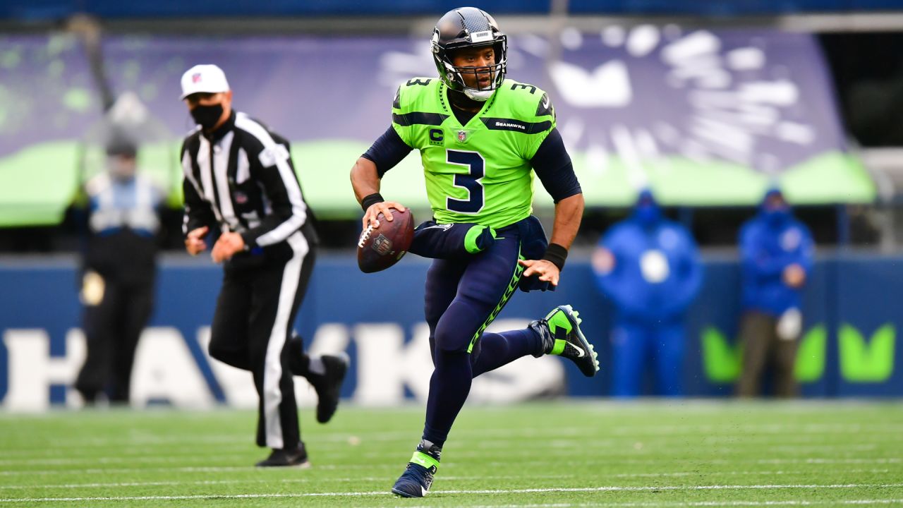 Seattle Seahawks quarterback Russell Wilson (3) greets wide receiver DK  Metcalf (14) during warmups before an NFL football game against the Tennessee  Titans, Sunday, Sept. 19, 2021, in Seattle. (AP Photo/John Froschauer