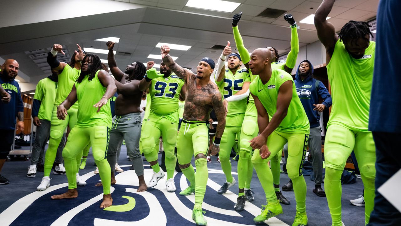 Seattle Seahawks linebacker Boye Mafe, center, works with Aaron Curry,  right, assistant defensive line and defensive ends coach, as linebackers  Tyreke Smith, left, and Joshua Onujiogu, second from left, during NFL  football