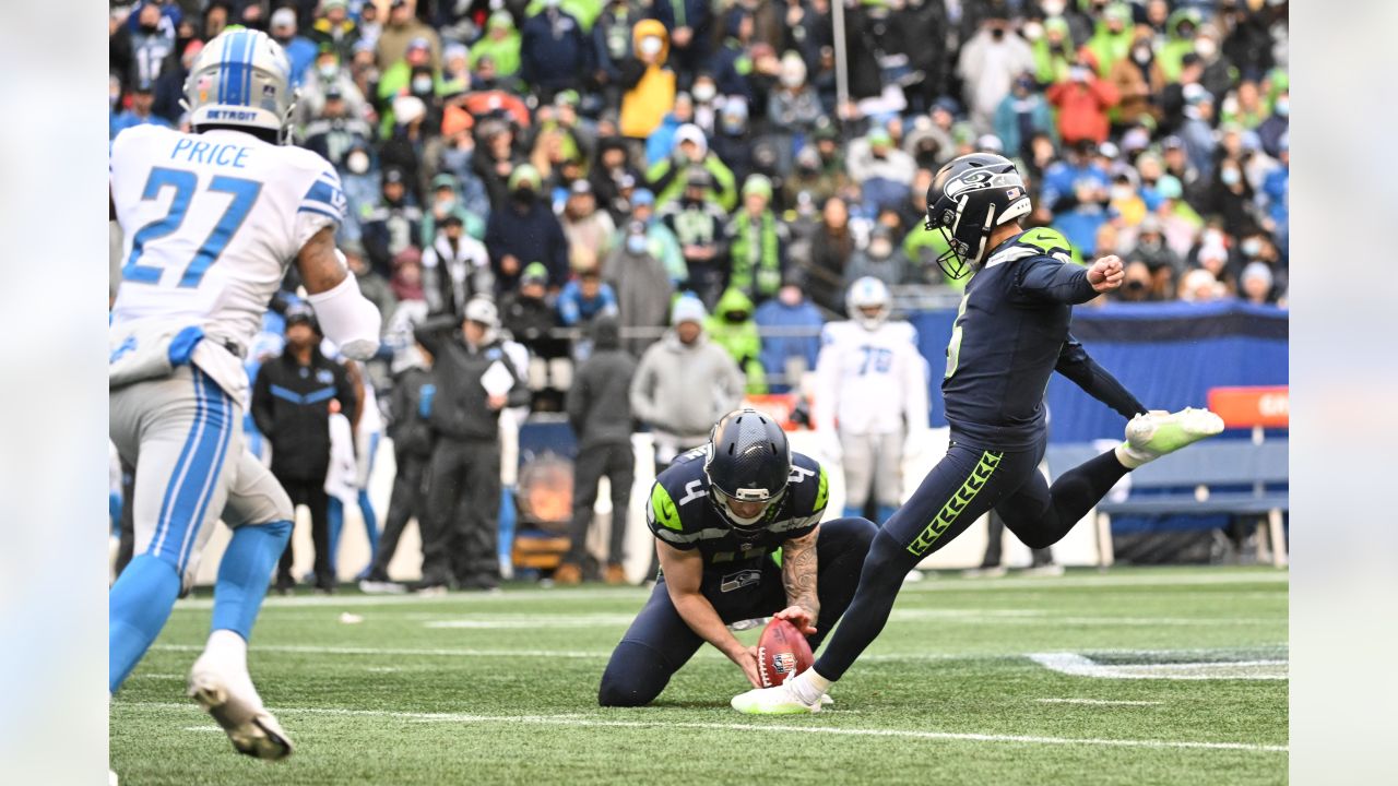 Seattle Seahawks quarterback Russell Wilson and wide receiver DK Metcalf  celebrate a touchdown during an NFL football game against the Detroit  Lions, Sunday, Jan. 2, 2022, in Seattle. The Seahawks won 51-29. (