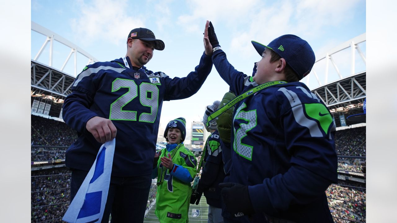 PHOTOS: Seattle Mariners Catcher Cal Raleigh Raises The 12 Flag