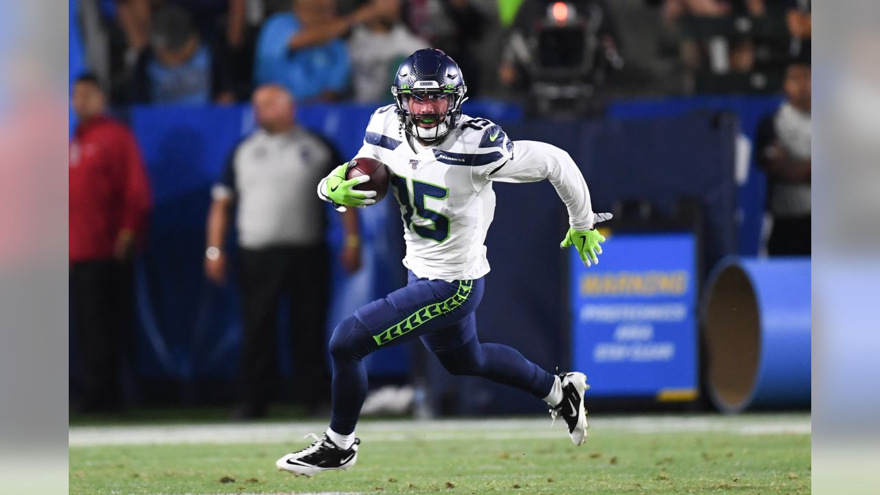 Seattle Seahawks wide receivers John Ursua (15) and Gary Jennings (11)  watch drills on the first