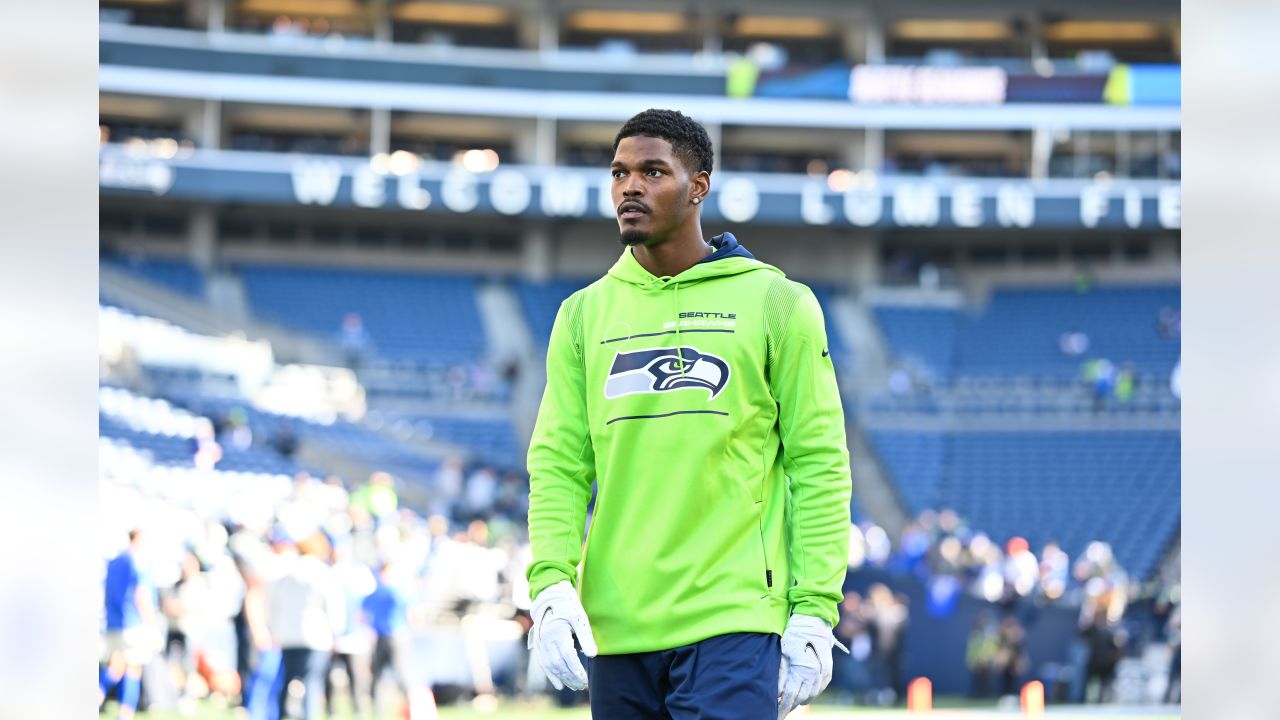 Seattle Seahawks wide receiver DK Metcalf, right, greets quarterback  Russell Wilson during warmups before an NFL football game against the Tennessee  Titans, Sunday Sept. 19, 2021, in Seattle. The Titans won 33-30