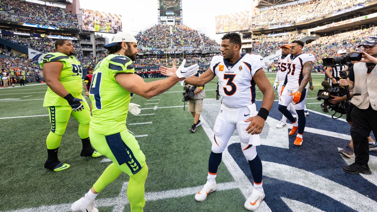 SEATTLE, WA - NOVEMBER 27: Seattle Seahawks defensive tackle Al Woods (99)  brings down Las Vegas Rai