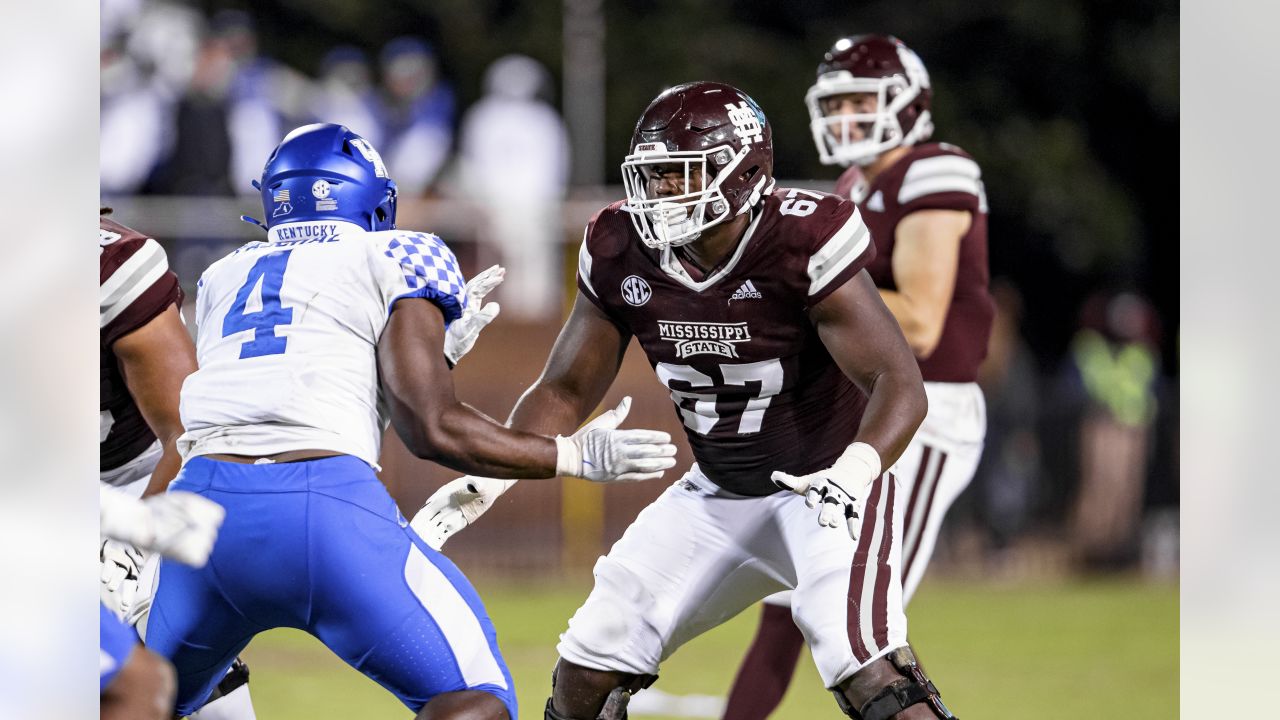 Mississippi State offensive tackle Charles Cross holds a team