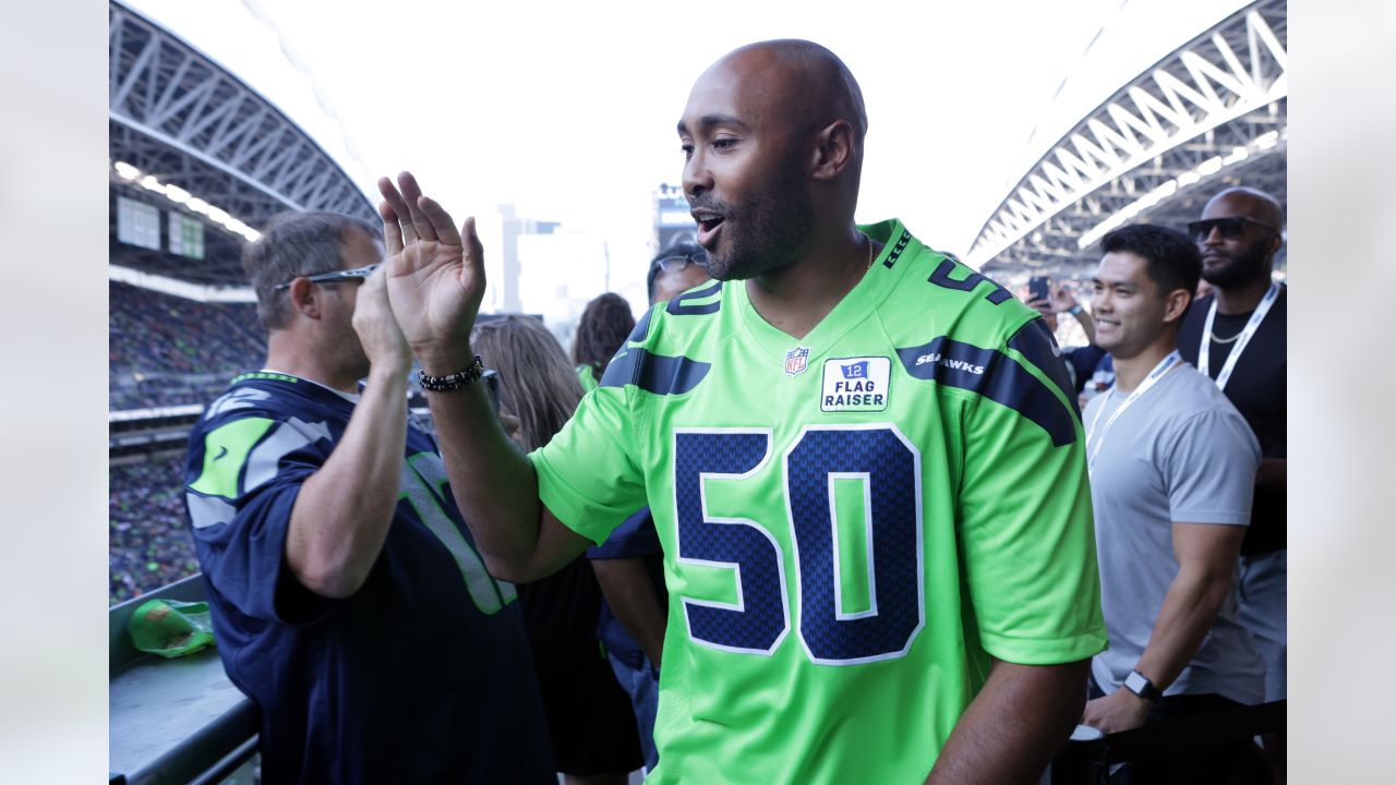 PHOTOS: Seahawks Legend Ricky Watters Raises 12 Flag For Week 1