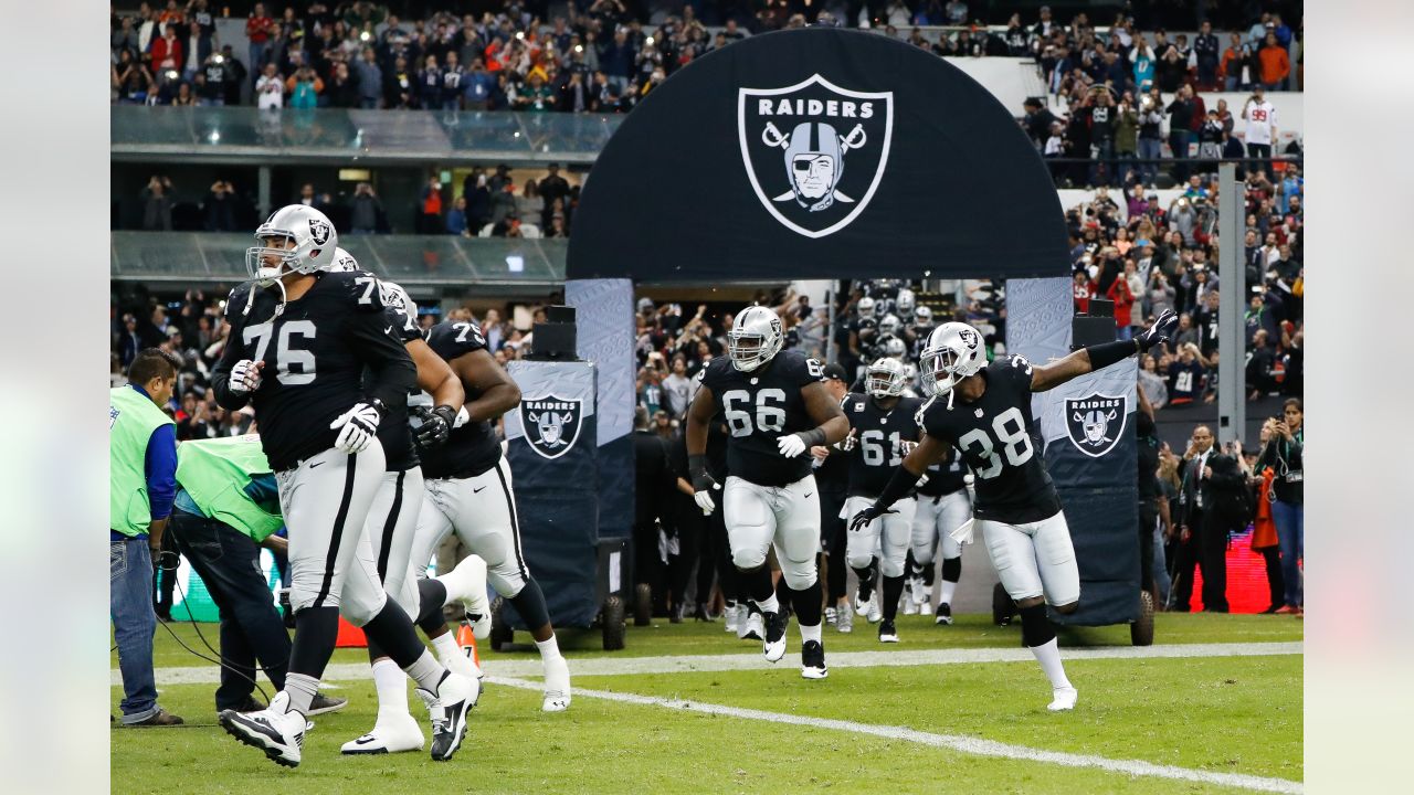 Oakland Raiders strong safety T.J. Carrie (38) tries to prevent