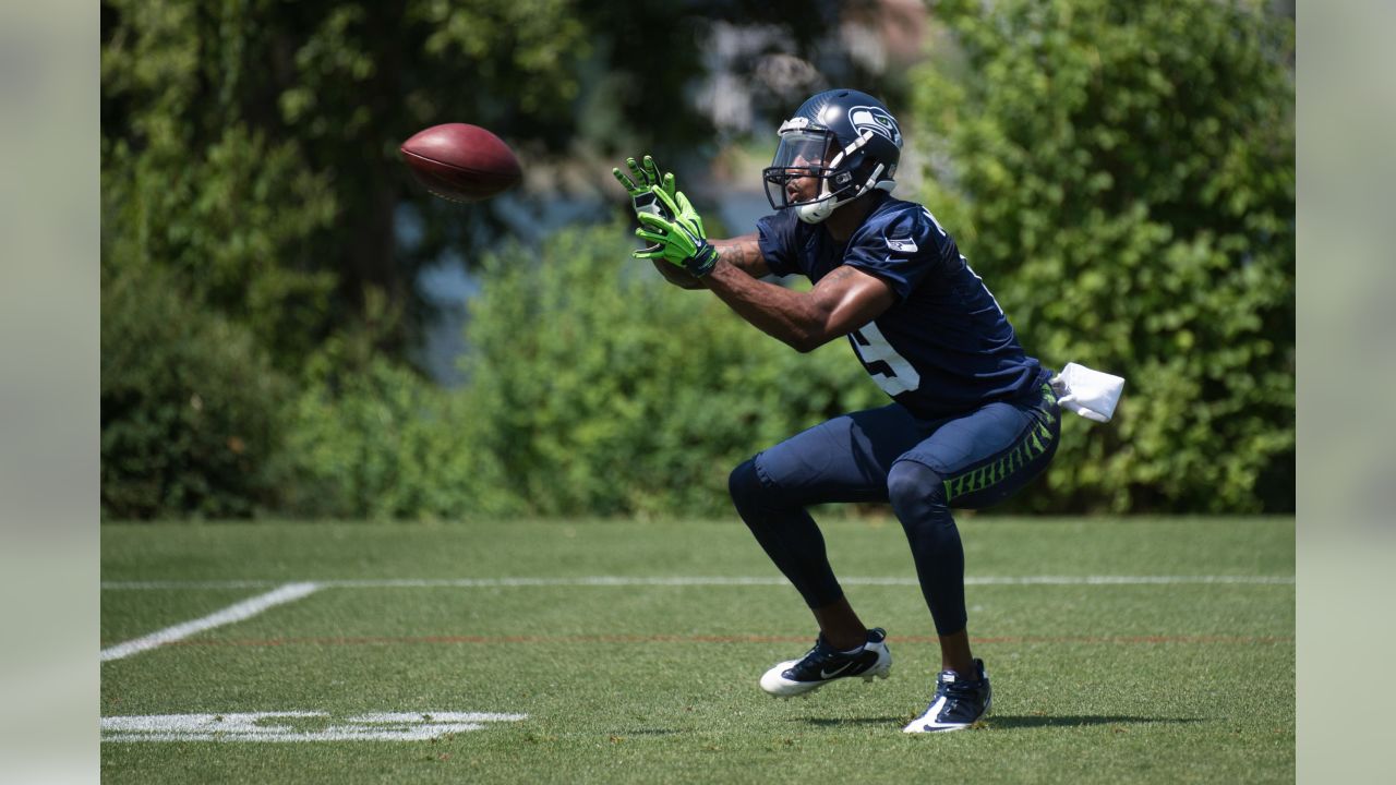 Seahawks defensive coodinator Kris Richard makes a tough phone