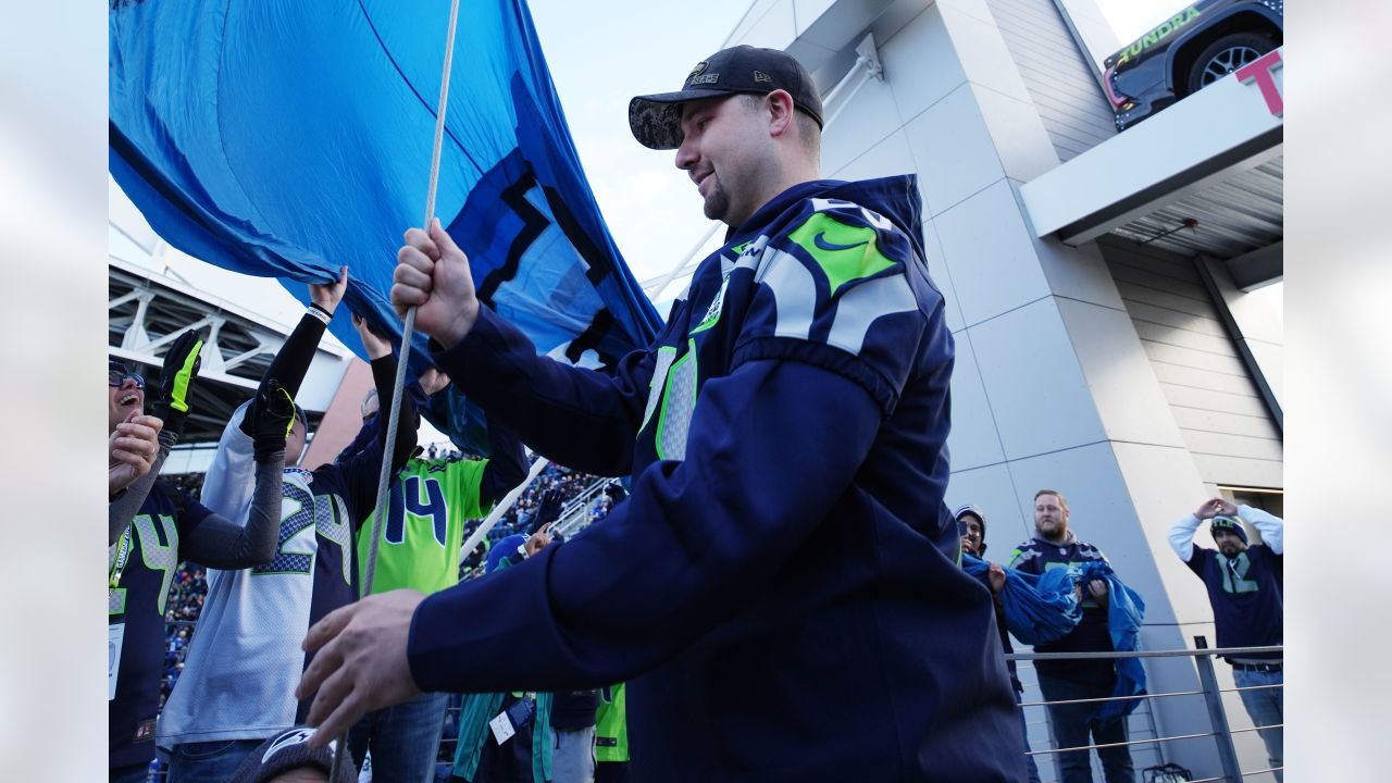 PHOTOS: Seattle Mariners Catcher Cal Raleigh Raises The 12 Flag