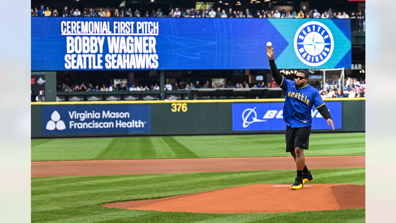 PHOTOS: Bobby Wagner Throws Out Ceremonial First Pitch At Mariners