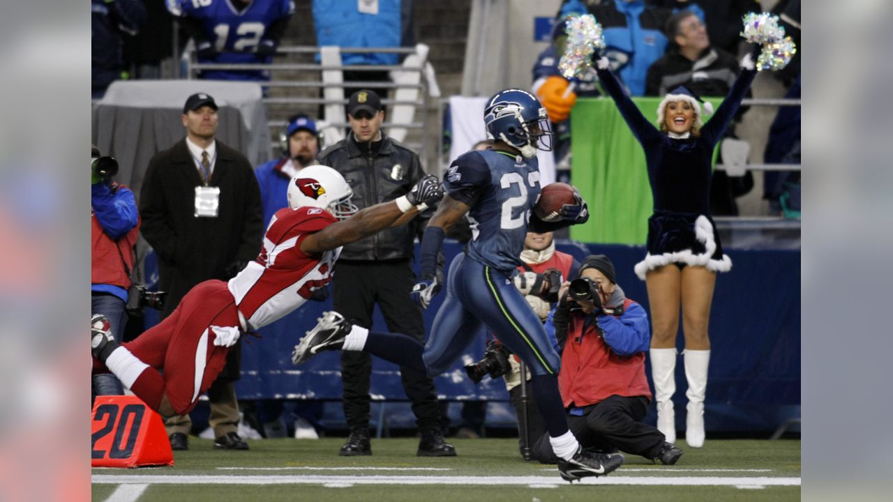 Running back Curt Warner of the Seattle Seahawks rushes for yards