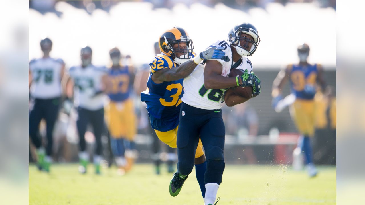 Seattle Seahawks wide receiver Tyler Lockett (16) is wrapped by Los Angeles  Rams Kickoff team during the first quarter at CenturyLink Field on October  7, 2018 in Seattle, Washington. The Rams beat