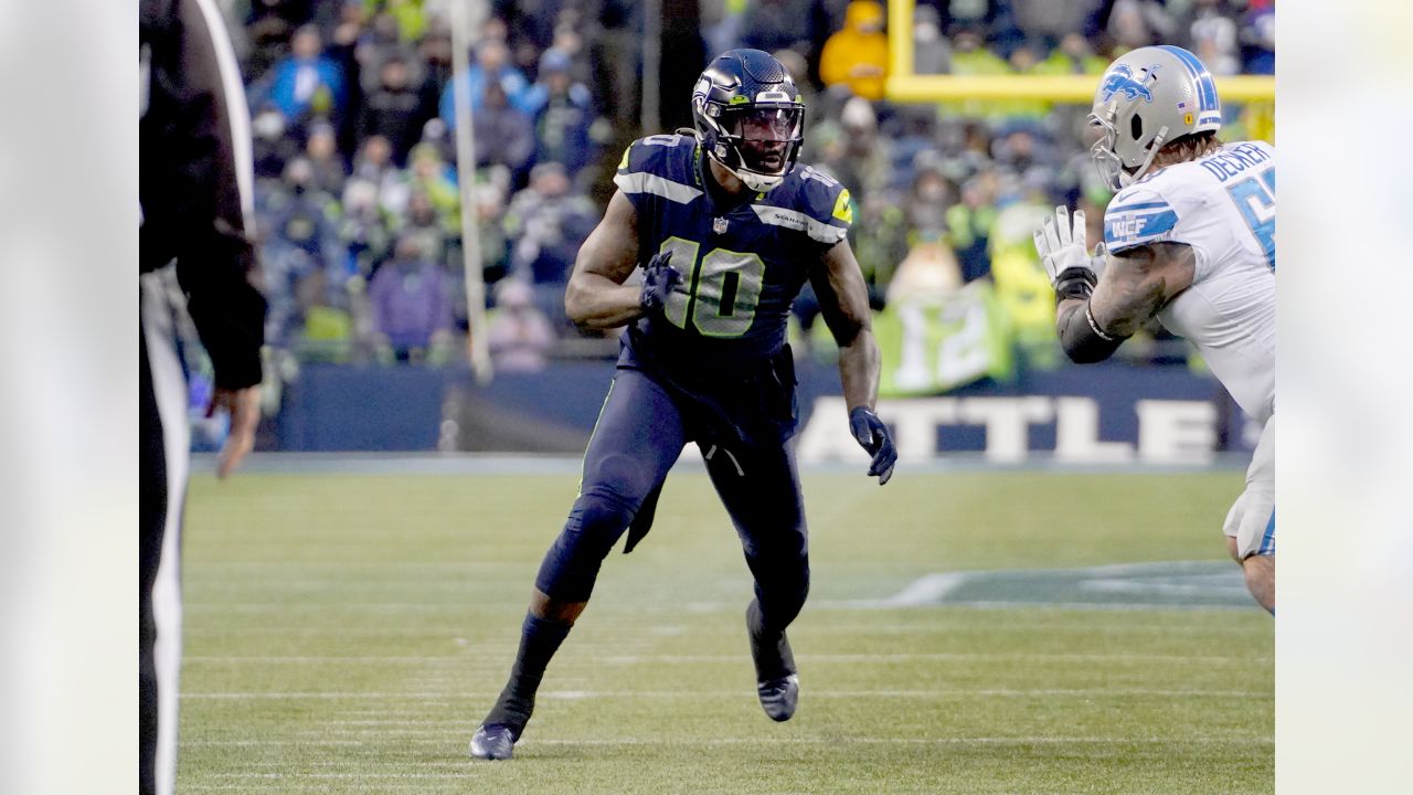 Seattle Seahawks quarterback Russell Wilson (3) greets wide receiver DK  Metcalf (14) during warmups before an NFL football game against the Tennessee  Titans, Sunday, Sept. 19, 2021, in Seattle. (AP Photo/John Froschauer