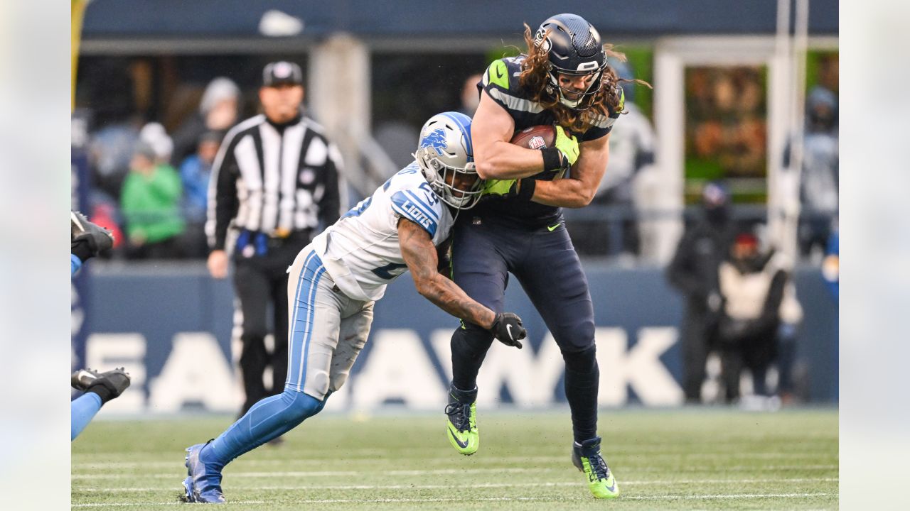 Seattle Seahawks quarterback Russell Wilson and wide receiver DK Metcalf  celebrate a touchdown during an NFL football game against the Detroit  Lions, Sunday, Jan. 2, 2022, in Seattle. The Seahawks won 51-29. (