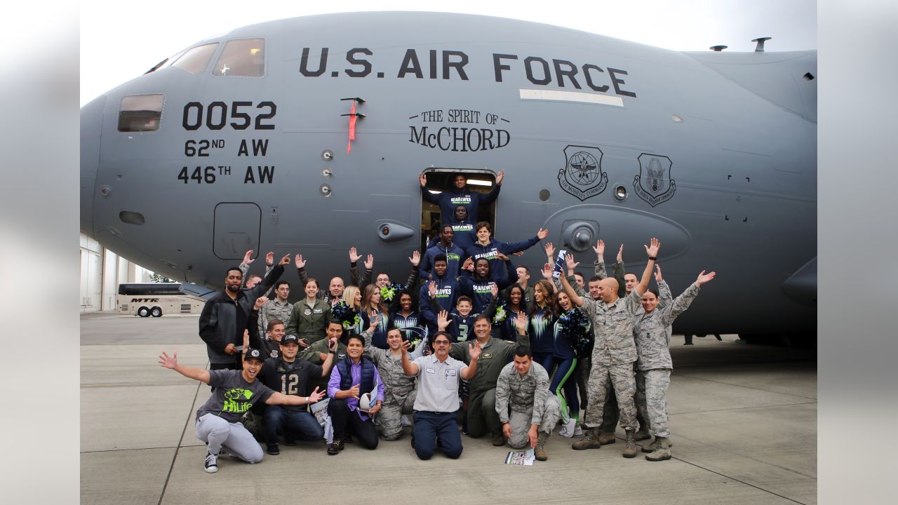 446th AW passes Seahawks' 12th-Man flag to Coast Guard > 446th