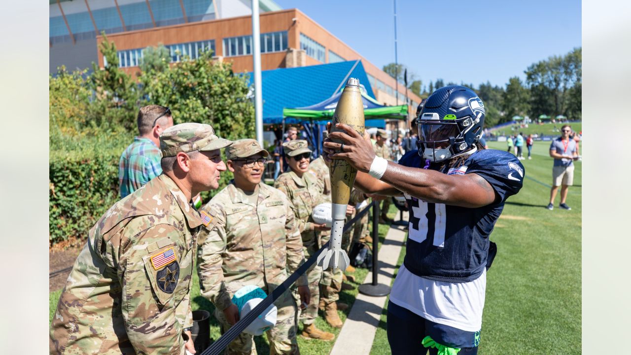 Seattle Seahawks - Lock taking time to meet with our military at practice  yesterday. Salute to service moment presented by USAA #SaluteToService