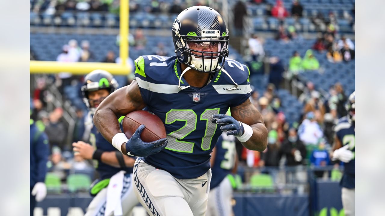 Seattle Seahawks wide receiver Dee Eskridge signs autographs following the  NFL football team's mock game Friday, Aug. 4, 2023, in Seattle. Eskridge  was suspended Friday for the first six games of the