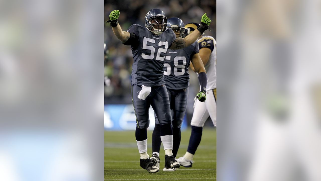 Seattle Seahawks' quarterback Charlie Whitehurst (L) watches a pass  completion to running back Justin Forsett against the St. Louis Rams in the  first quarter of the NFL's Western Division Championship game on