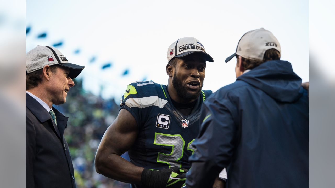 Seahawks DE Bennett celebrates with bicycle ride