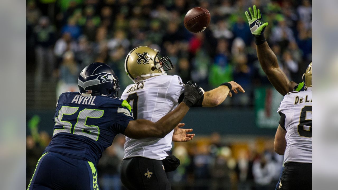 Seattle Seahawks defensive end Cliff Avril (56) celebrates after sacking  New Orleans Saints quarterback Drew Brees during the third quarter of an  NFC divisional playoff NFL football game in Seattle, Saturday, Jan.