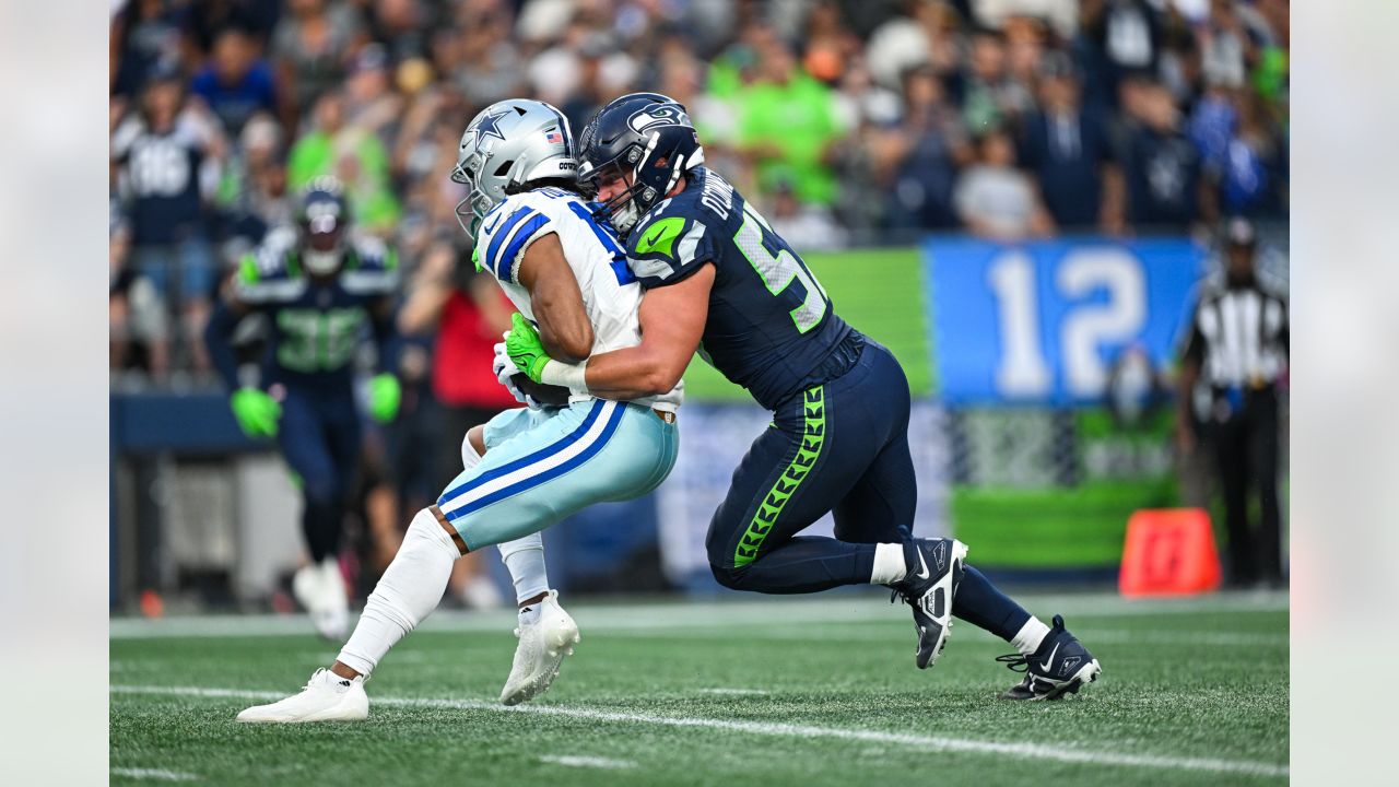 Seattle Seahawks quarterback Holton Ahlers looks to pass against the Dallas  Cowboys during the first half of a preseason NFL football game Saturday,  Aug. 19, 2023, in Seattle. (AP Photo/Stephen Brashear Stock