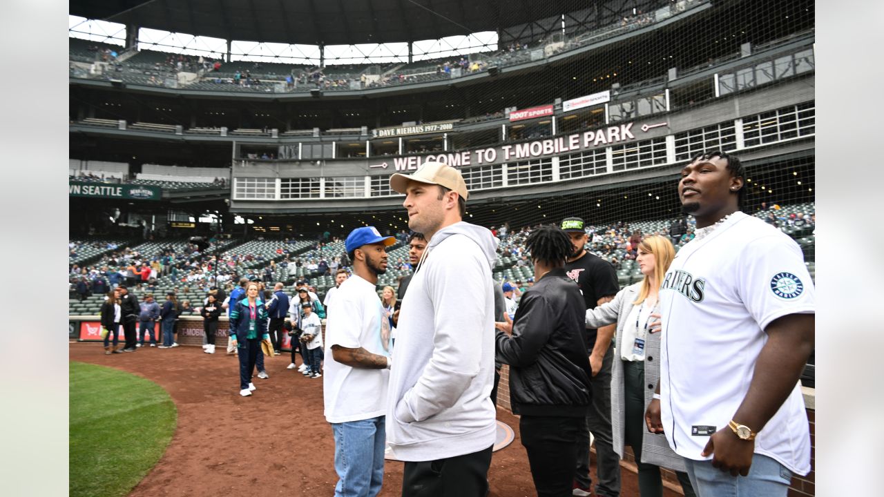 NFL football tackle Charles Cross, the Seattle Seahawks' first-round draft  pick, throws out the first pitch of a baseball game between the Seattle  Mariners and the Houston Astros, Sunday, May 29, 2022