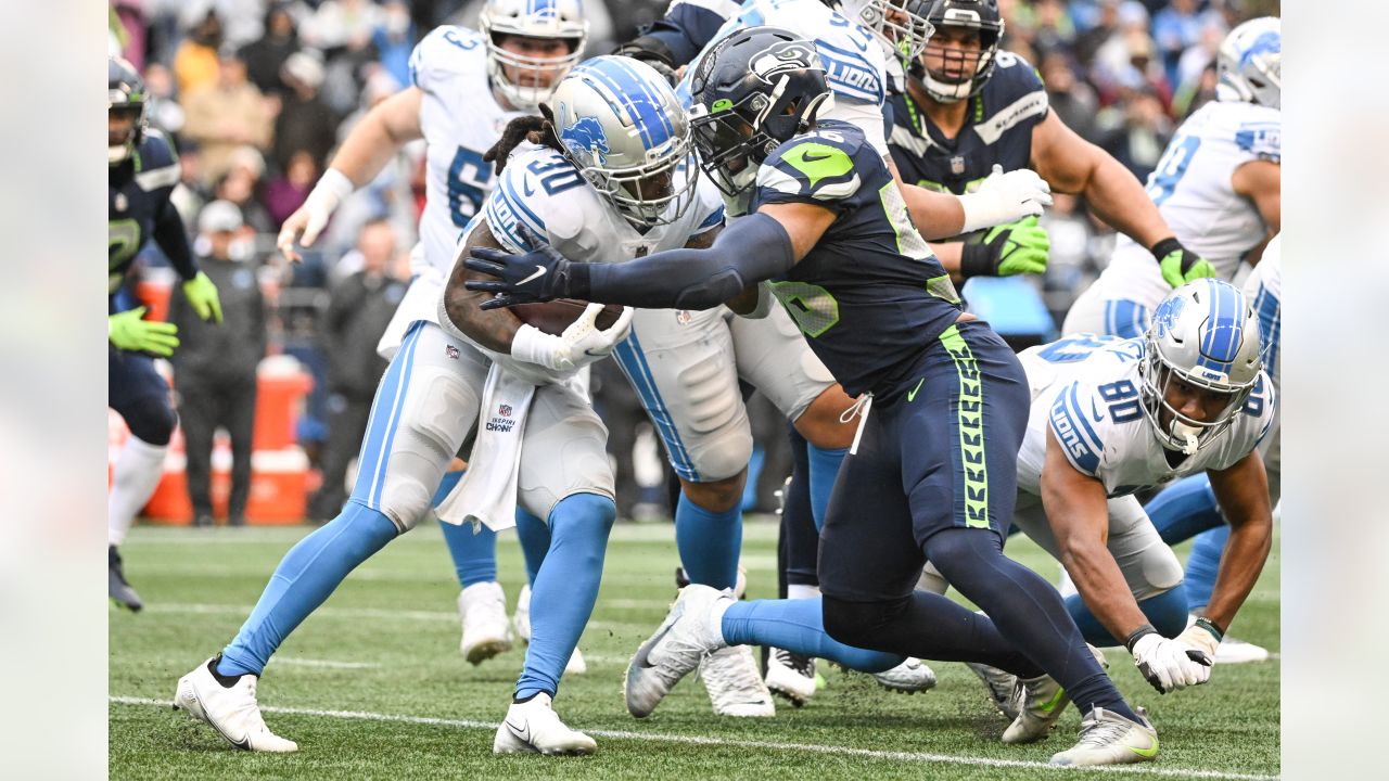 Seattle Seahawks quarterback Russell Wilson and wide receiver DK Metcalf  celebrate a touchdown during an NFL football game against the Detroit  Lions, Sunday, Jan. 2, 2022, in Seattle. The Seahawks won 51-29. (