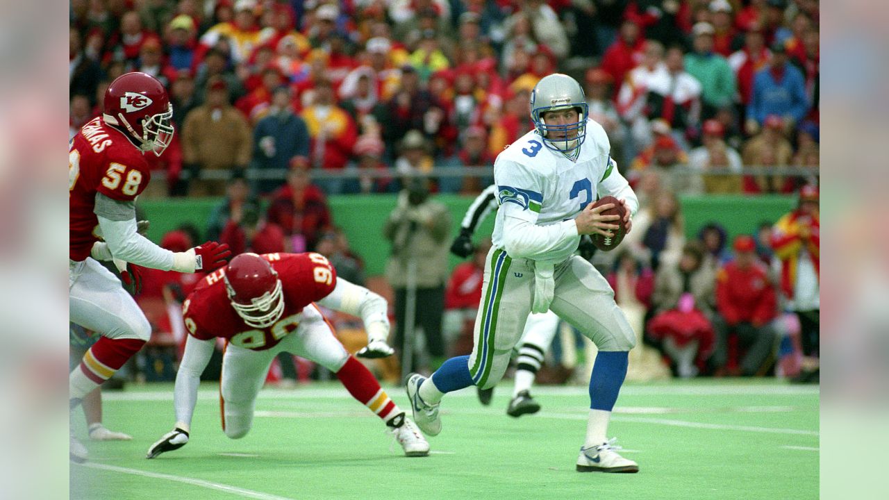 Seattle Seahawks - Seahawks quarterback Rick Mirer attempts to elude  Derrick Thomas during an NFL Football game against the Kansas City Chiefs  on January 2, 1994 in Kansas City, Missouri.