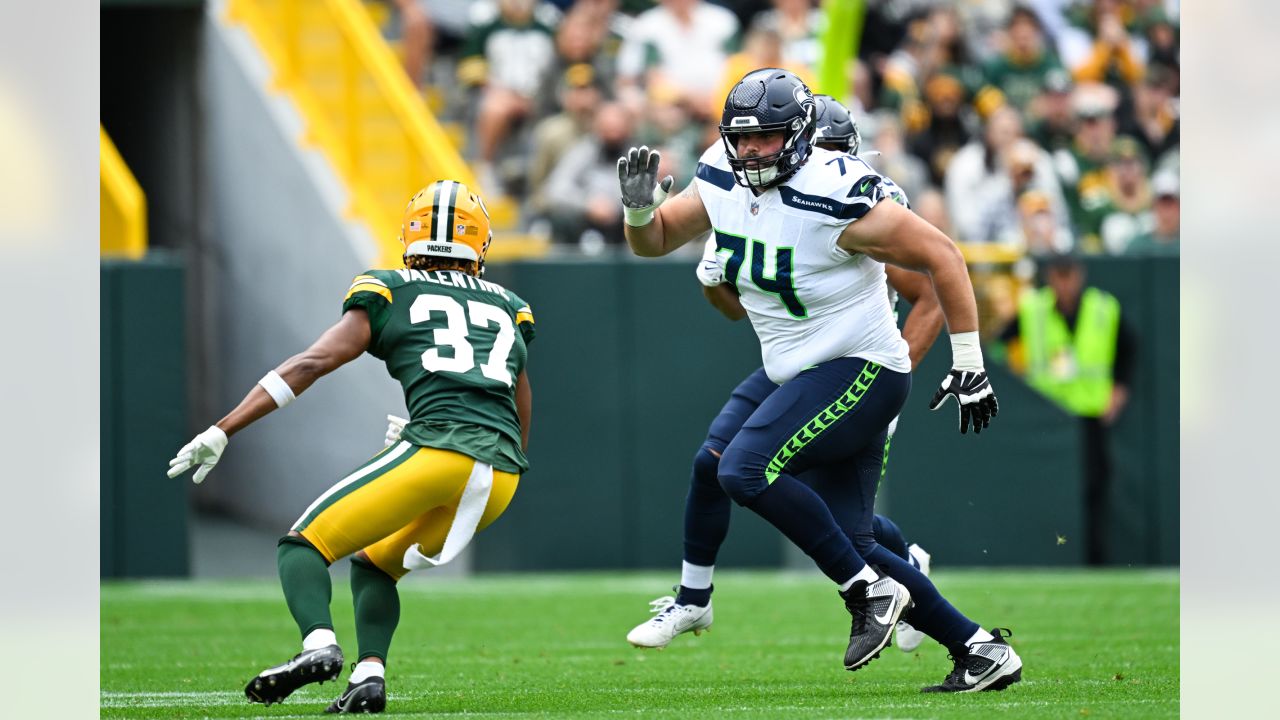 Seattle Seahawks defensive end Dre'Mont Jones (55) spikes the ball after a  teammate scored a touchdown during an NFL preseason game against the Green  Bay Packers Saturday, Aug. 26, 2023, in Green