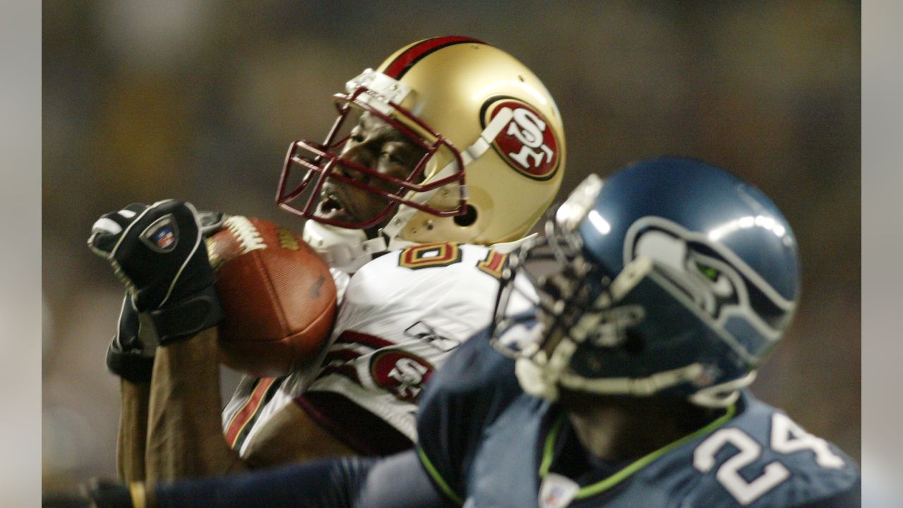 Seattle Seahawks wide receiver Darrell Jackson (82) celebrates in front of  Washington Redskins defensive back Ryan Clark, in back, after scoring a 29  yard touchdown in the second quarter during their NFC