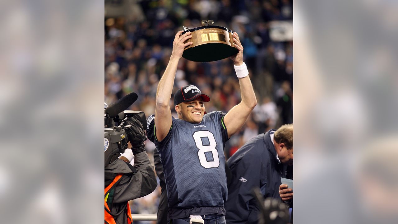 Seattle Seahawks quarterback Matt Hasselbeck, right, holds the NFC  championship trophy as he stands with running back Shaun Alexander  following their NFC championship football game in Seattle, Sunday, Jan. 22,  2006. The