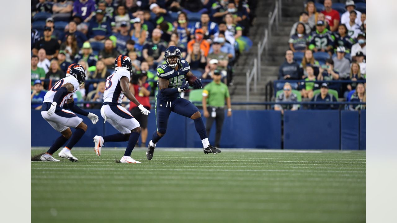 DeeJay Dallas of the Seattle Seahawks gestures to the fans during