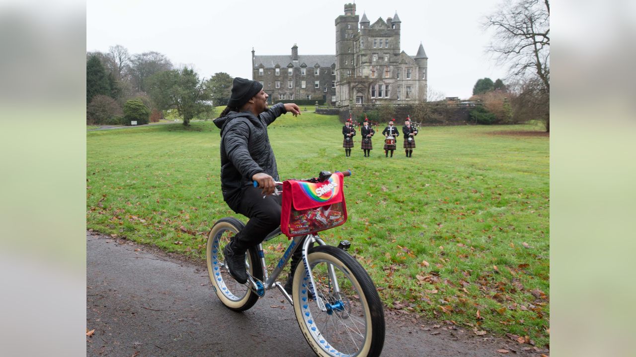 Marshawn Lynch Goes To Scotland, Plays Bagpipes, Rides a Bike And Hands Out  Skittles