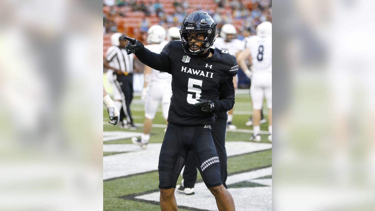 Hawaii wide receiver John Ursua (5) reaches toward the end zone as Wyoming  free safety Andrew Winged (28) during their game Saturday, Sept. 23, 2017.  (Josh Galemore/The Casper Star-Tribune via AP Stock