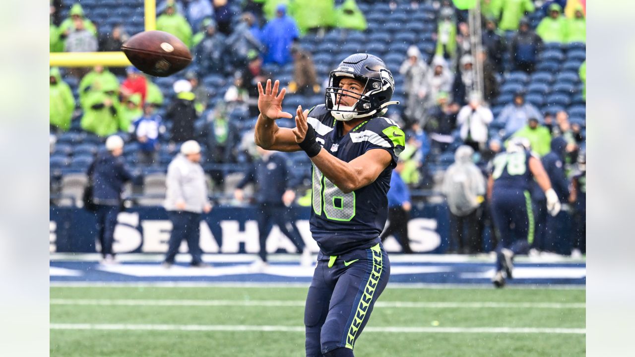 NFL Hall of Famer Steve Largent presents the Steve Largent award to Seattle  Seahawks wide receiver Tyler Lockett (16) before an NFL football game  against the Los Angeles Rams, Sunday, Jan. 8