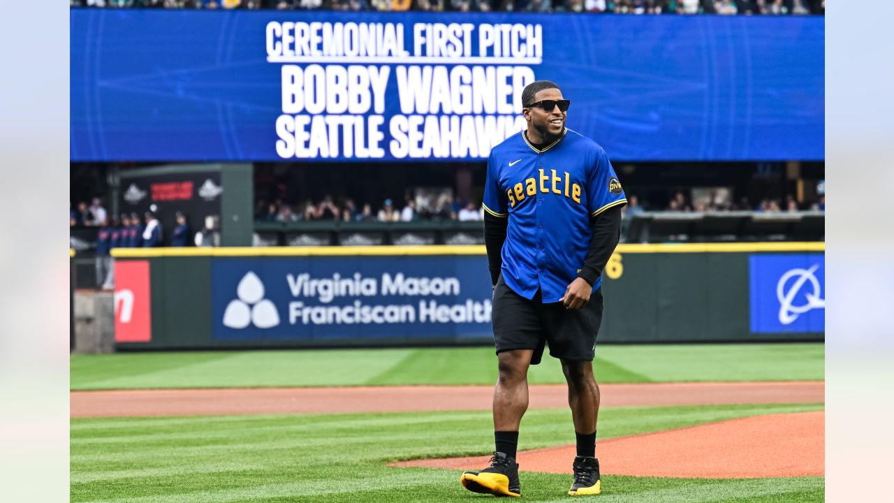 PHOTOS: Bobby Wagner Throws Out Ceremonial First Pitch At Mariners