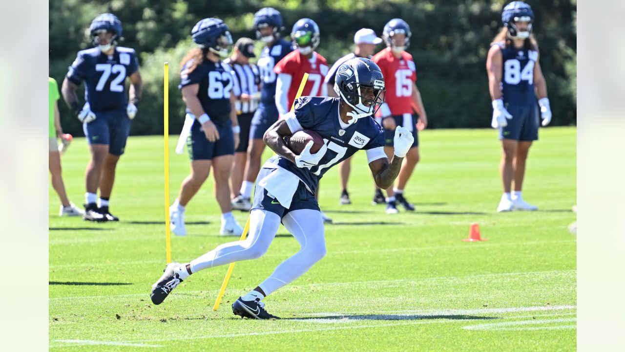 Seattle Seahawks wide receiver John Hall (82), linebacker Ben Burr-Kirven ( 48) and cornerback Montrae Braswell, right, celebrate during a preseason  NFL football game against the Dallas Cowboys, Saturday, Aug. 19, 2023, in