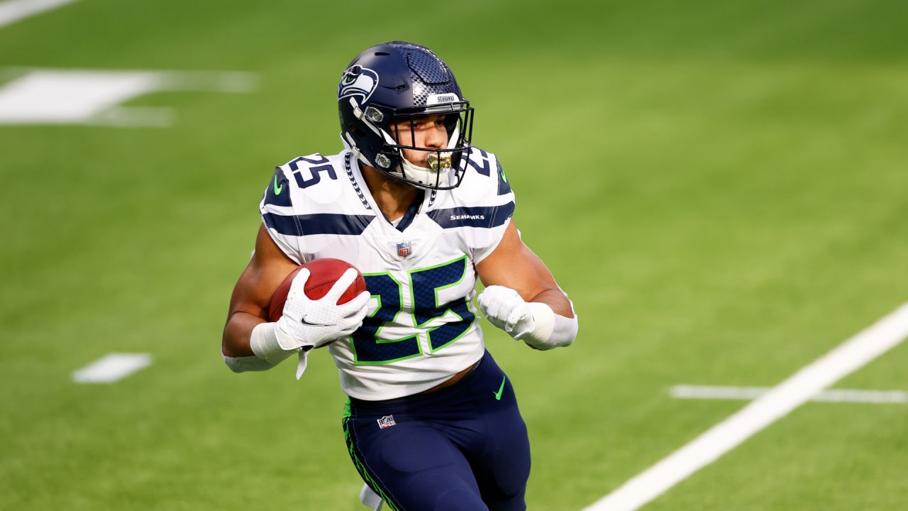 Seattle Seahawks running back Travis Homer (25) during an NFL Preseason  football game against the Chicago