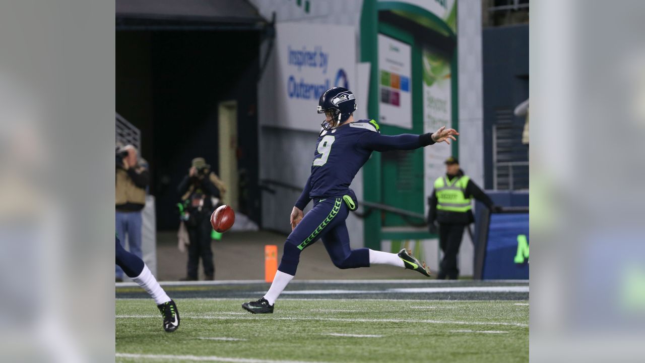 Larry Wales, of Seattle, wears the #14 jersey of Seattle Seahawks