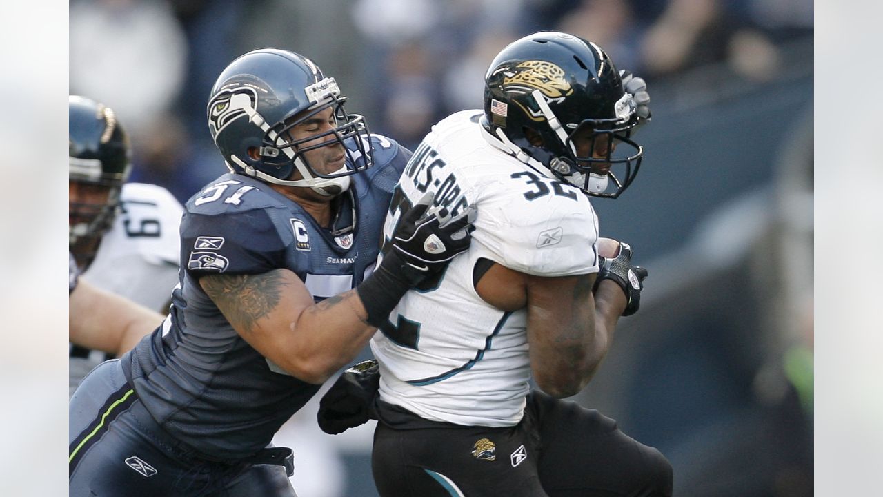 Raiders linebacker Tanner Muse (55) leaps to try and block a pass from  Seattle Seahawks quarter …