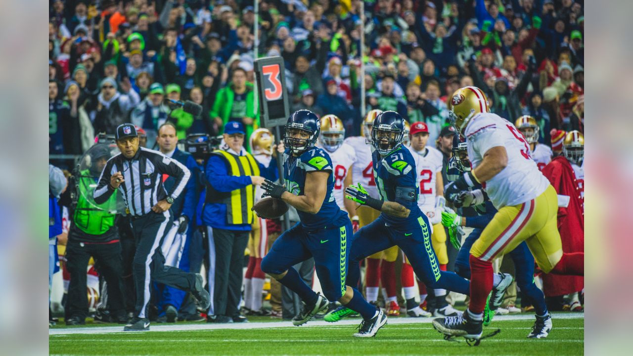 Seattle Seahawks running back Marshawn Lynch (24) dons his gloves during an  injury time out during the NFL Championship Game against the San Francisco  49ers at CenturyLink Field in Seattle, Washington on