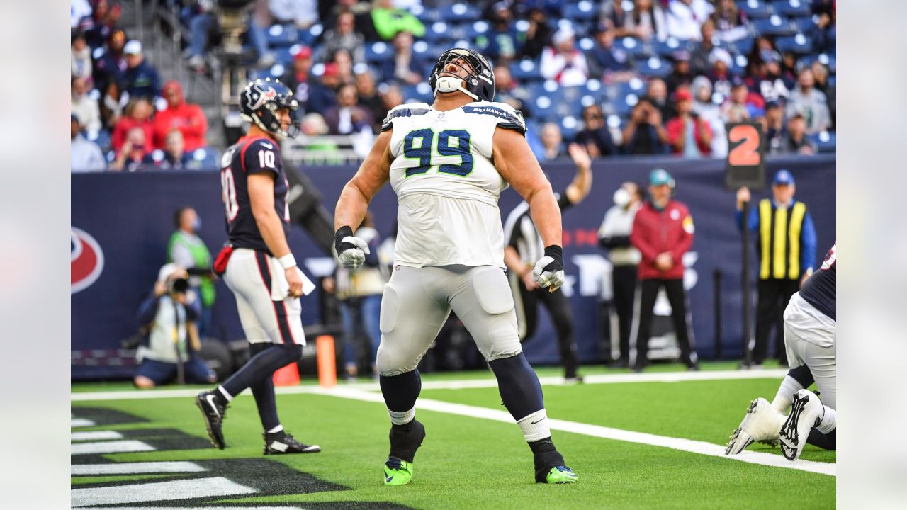 Seattle Seahawks defensive tackle Al Woods (99) reacts after a